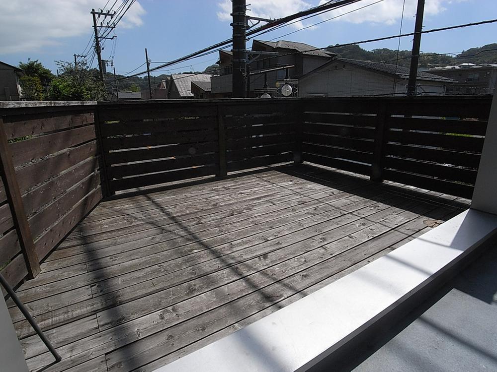 Balcony. Spacious wood deck.