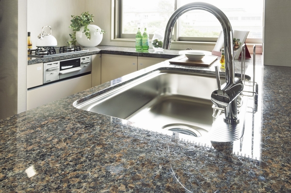 Counter top in the kitchen is a natural granite finish