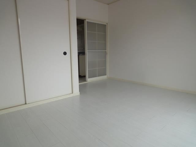 Living and room. It is a white floor with cleanliness.