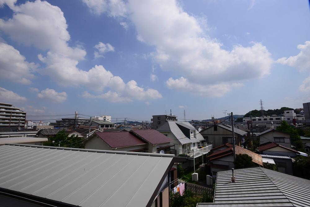 View photos from the dwelling unit. Peripheral spreads less blue sky high building.