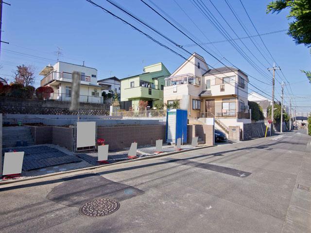 Local appearance photo. In a quiet residential area, Two buildings under construction