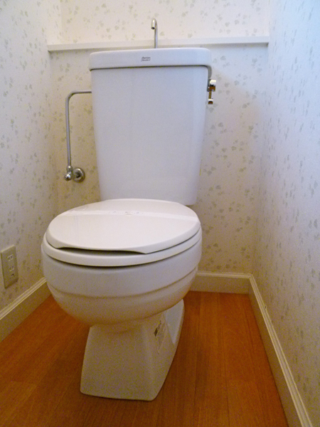 Toilet. Toilet with a small window that can be ventilated