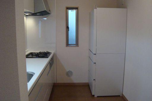 Kitchen.  [kitchen] The kitchen space has a window.