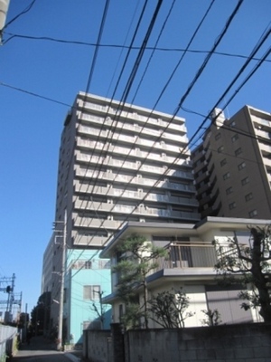 Building appearance. Gray shine in blue sky is wonderful apartment