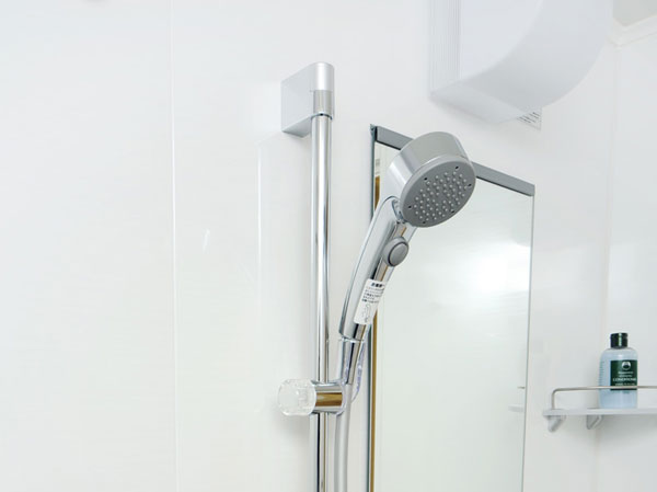 Bathing-wash room.  [One push shower] Adopt a slide shower hook that can be adjusted to one push shower and a height that can stop the water at hand of a button. (Same specifications)