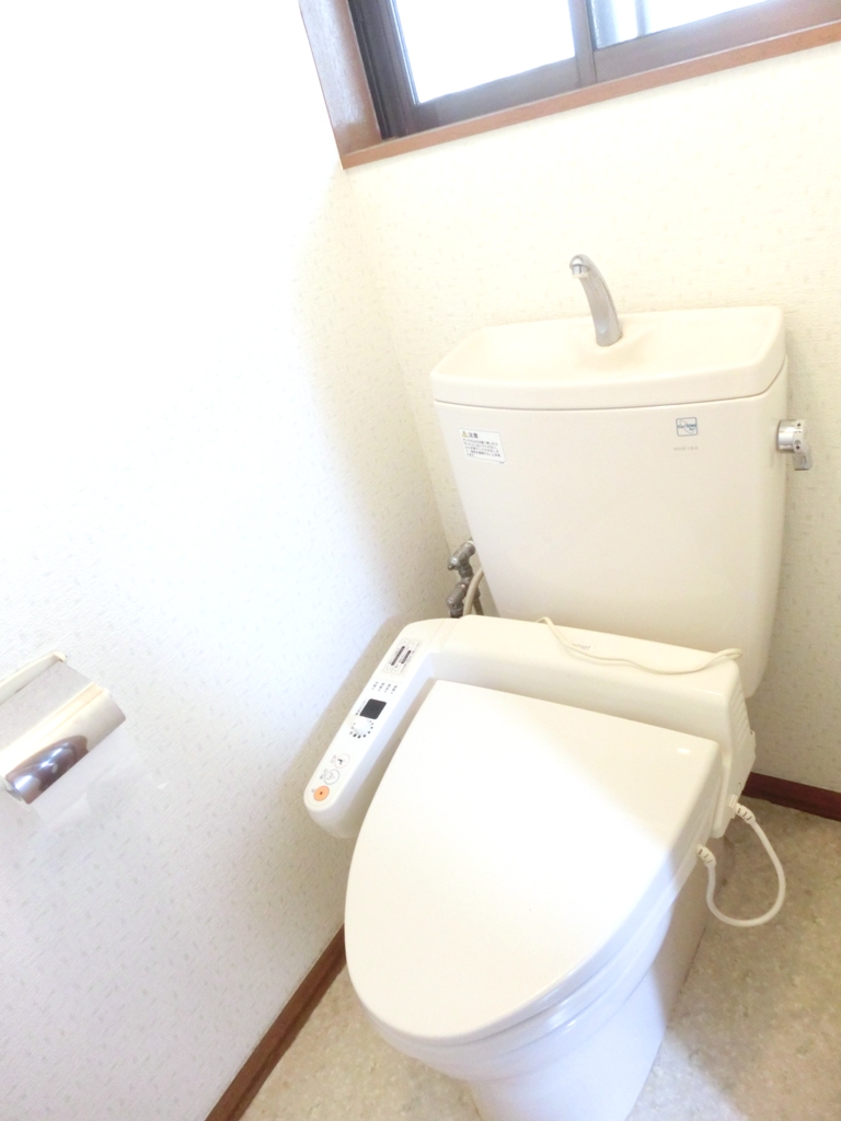 Toilet. Comfortable with warm water cleaning toilet seat to the toilet