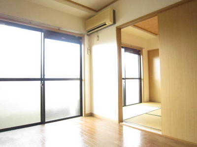 Living and room. It is a photograph of the same type of room. 