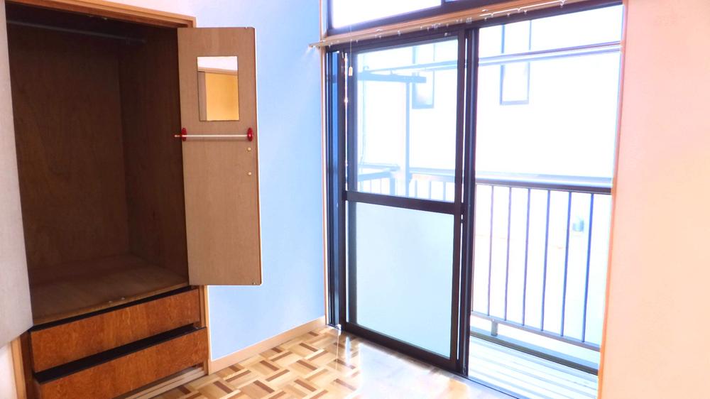 Non-living room. It contains the bright sunlight from the balcony.
