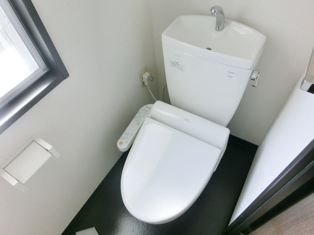 Toilet. It comes with a window ventilation easy bidet with a toilet