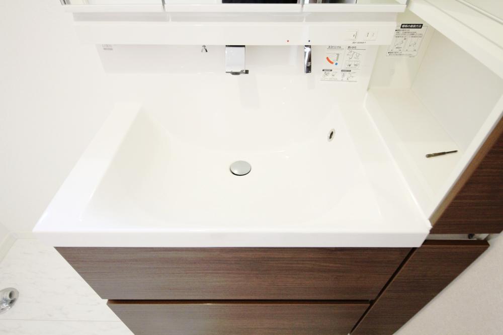 Wash basin, toilet. East Building