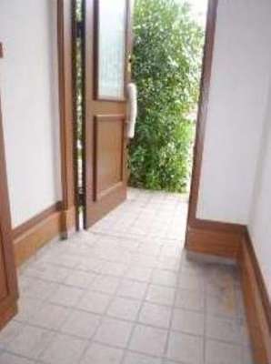 Entrance. It is the front door of the tiled