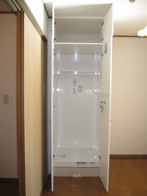 Other Equipment. Laundry Area with a door
