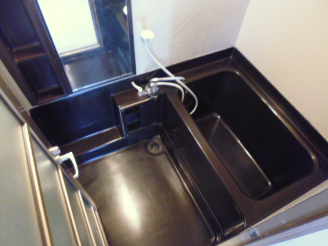 Bath. It is a photograph of another in Room