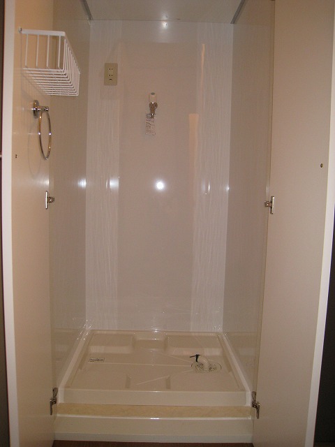 Other Equipment. Washing machine in the room With doors