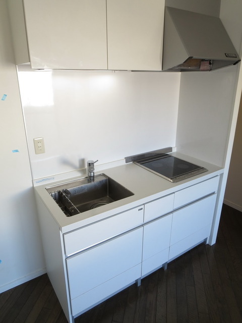 Kitchen. Dishes get on two-burner stove IH