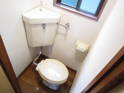 Toilet. It is bright in the sunshine during the day so that with a window