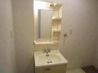 Washroom. It is a photograph of the same type of room.