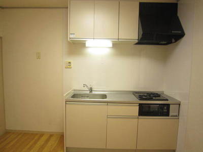 Kitchen. It is a photograph of the same type of room.