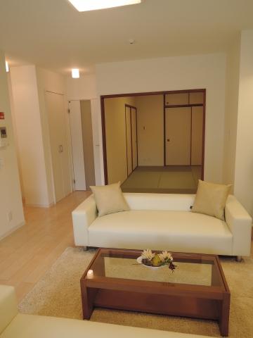 Living. Next to the living room is a Japanese-style room