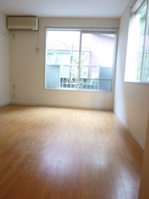 Living and room. It is a reference photograph of the corner room. There is no next to the window. 