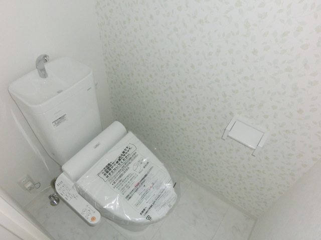 Toilet. Toilet is equipped with a convenient Washlet