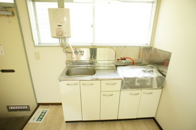 Kitchen. Water heater and gas stove will be in service goods. 