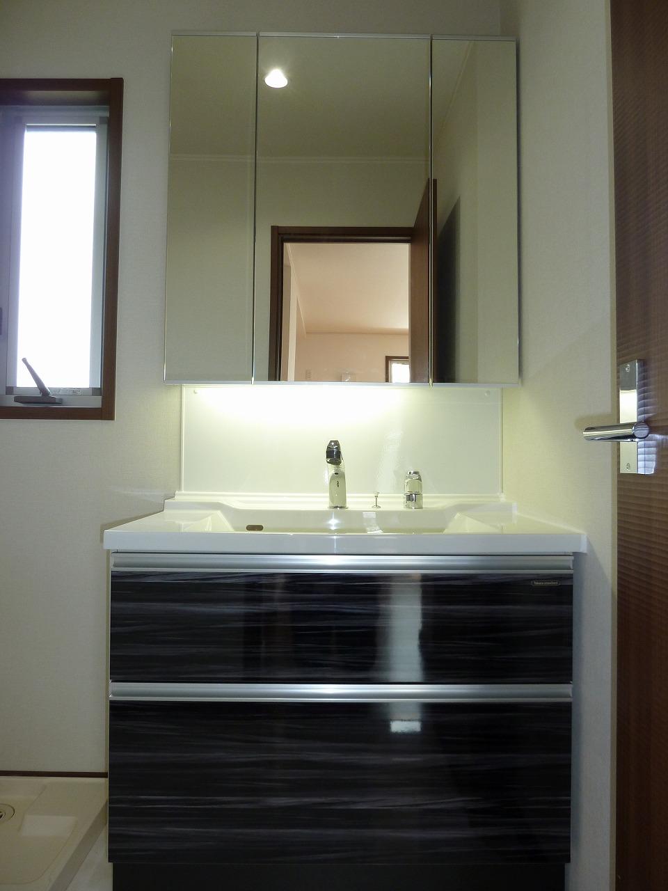 Wash basin, toilet. Wide vanity mirror finish classy