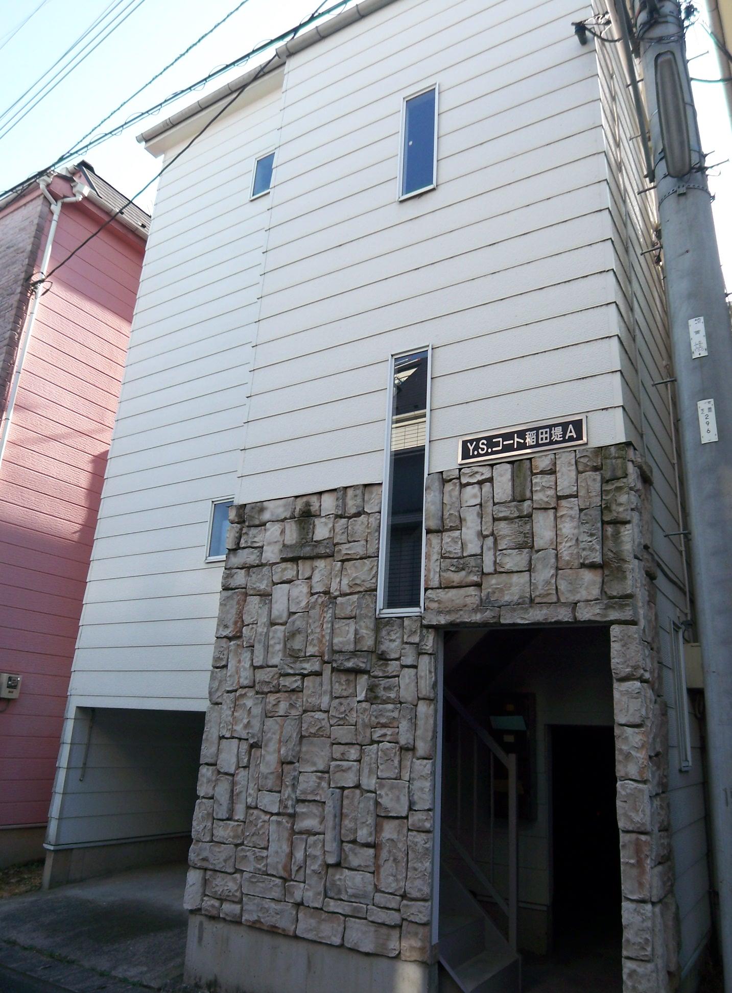 Building appearance. The first floor is parking, Bicycle-parking space