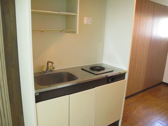Kitchen. It is an electric stove with a 1-neck
