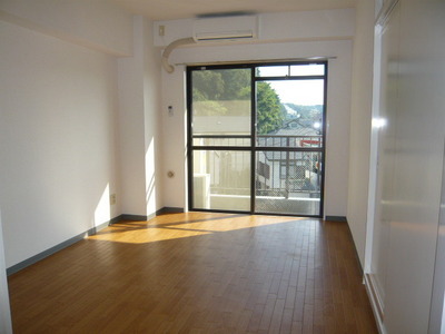 Living and room. This room of flooring with a warmth of wood. Sunny! 