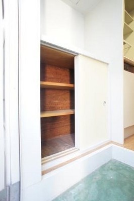 Entrance. Large cupboard with storage! 