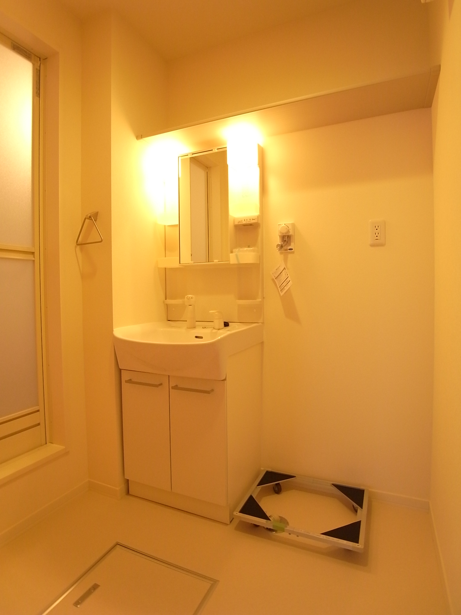 Washroom. Washbasin with shower, Laundry Area