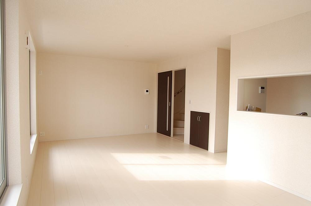 Living. Room design with the white tones. To modern impression Brown of the door becomes an accent.