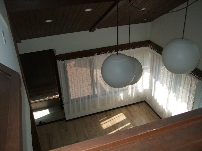 Non-living room. Is a living photograph seen from the second floor living room. 