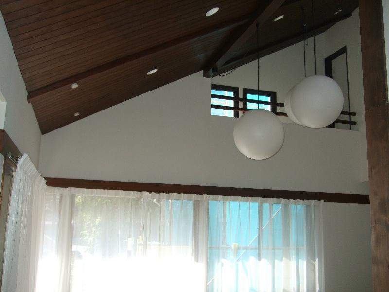 Living. It is the gradient ceiling photo of living. There is a sense of open. 