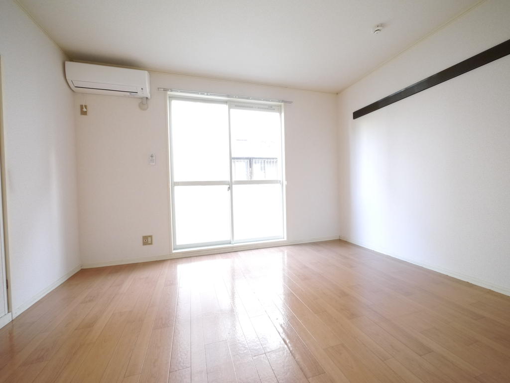 Living and room. There is a large window to the south