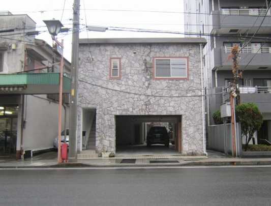 Local appearance photo. Exterior of the building.  The front is a public road of a one-way street. 