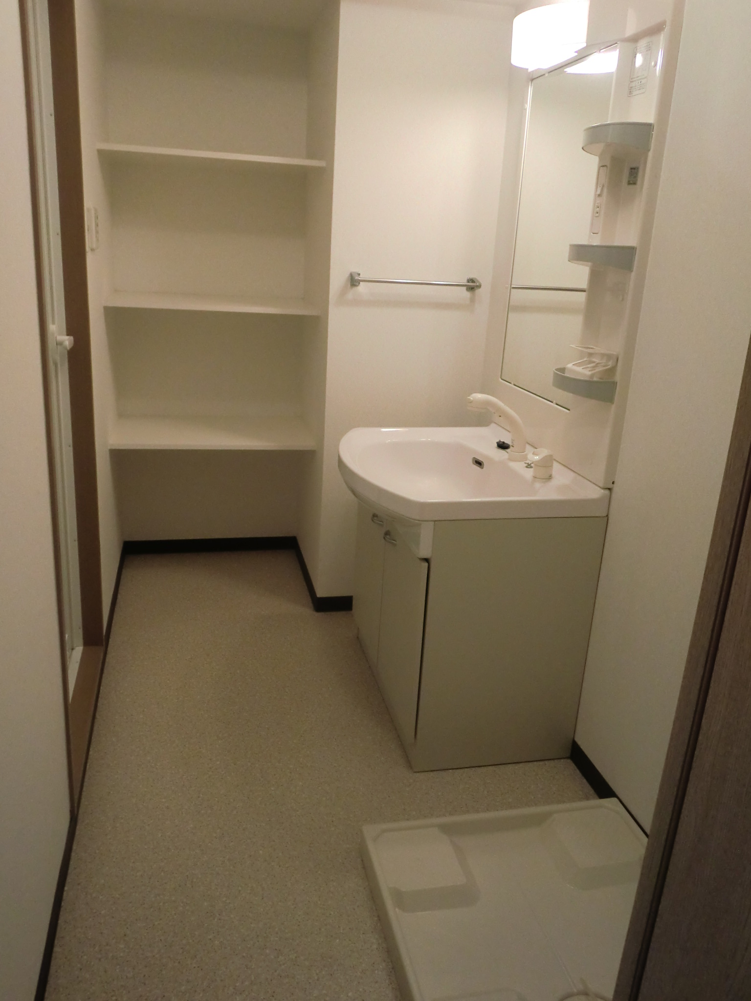 Washroom. Washbasin with shower Dresser ・ Laundry Area