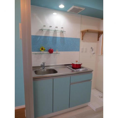 Kitchen. Bright kitchen use a mosaic tile on the front (with IH heater)