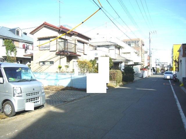 Local photos, including front road. Adjacent road (south 6m public road)