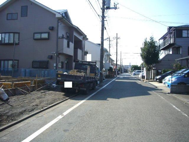 Local photos, including front road. Adjacent road (north 6m)