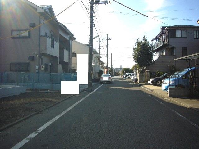 Local photos, including front road. Adjacent road (north 6m)