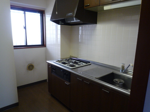 Kitchen. It is a bright kitchen has a window.