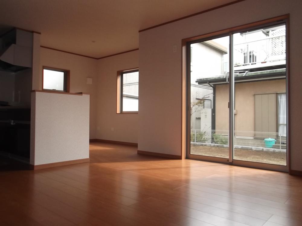 Living. It is living bathed in bright sunlight from the south.