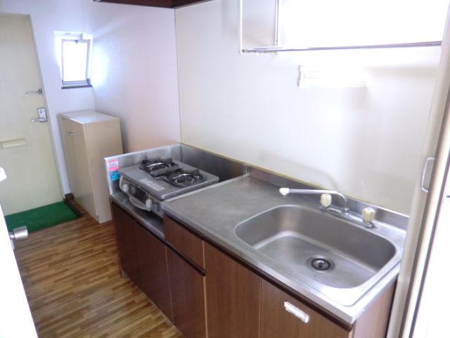 Kitchen. Bright kitchen because there is a window in the front door aside. 