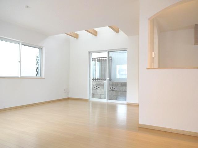 Living. 1 Building Bright living room with vaulted ceiling