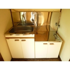 Kitchen. It is a compact kitchen.