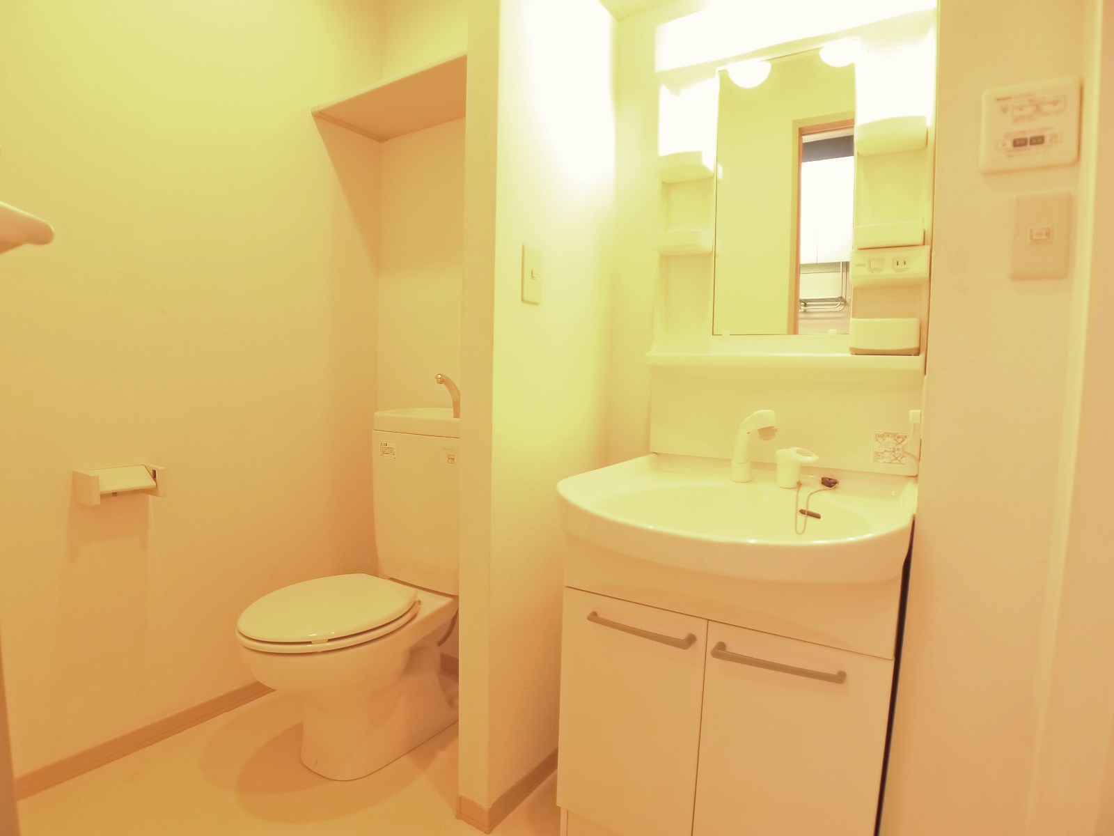 Washroom. Small shelf with the top of the shower type is with a wash basin your toilet