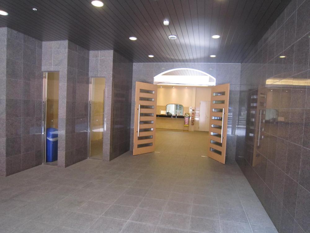 Entrance. There is a courier and cleaning available at front.