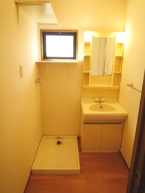 Washroom. Is a dressing room, There is also a small window.